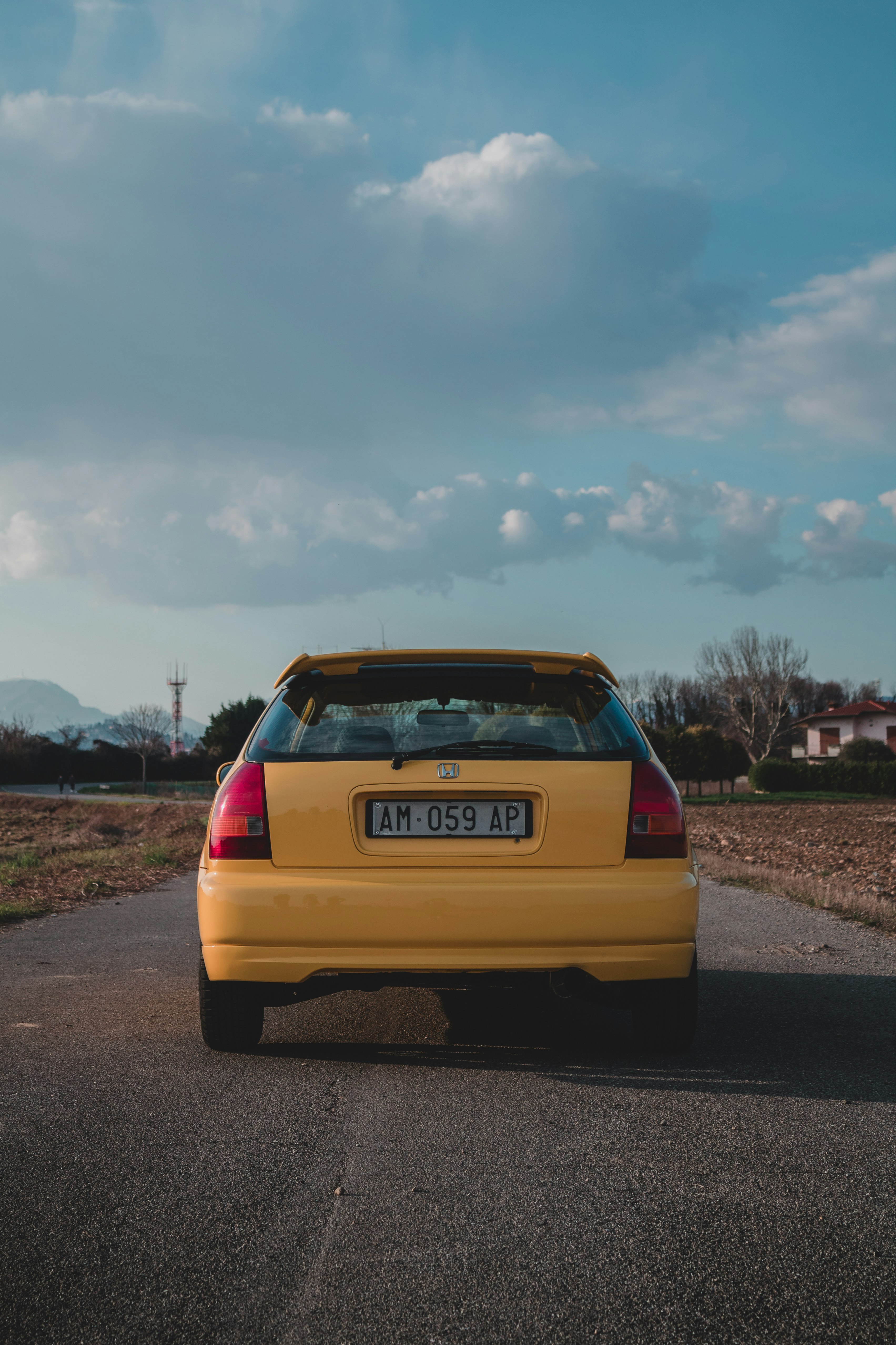 yellow chevrolet car on road during daytime